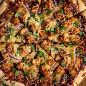Chicken BBQ pizza with smoky barbecue sauce, chicken, red onion and cilantro
